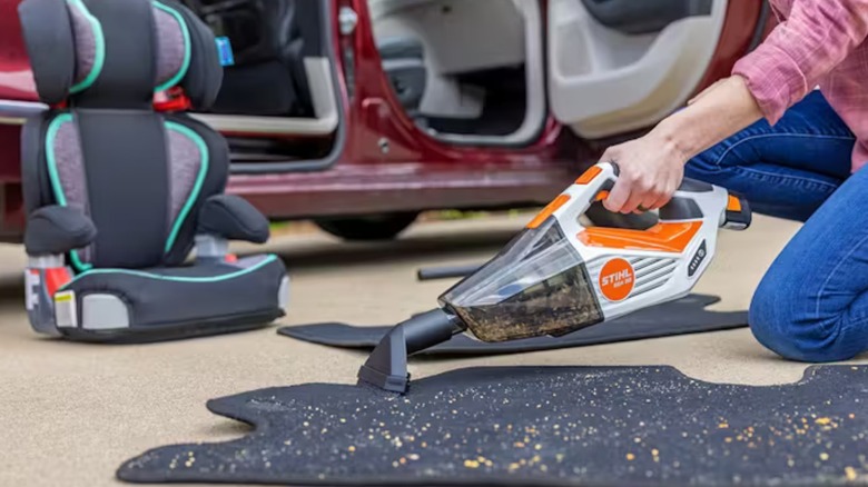 A person using a Stihl SEA 20 mini vacuum