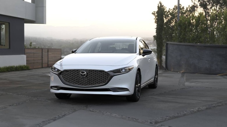 2026 Mazda 3 in modern driveway