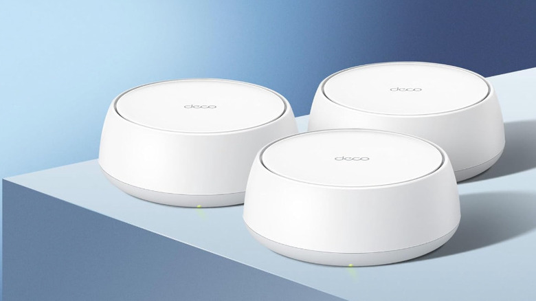 Three TP-Link Deco 7 mesh wi-fi devices