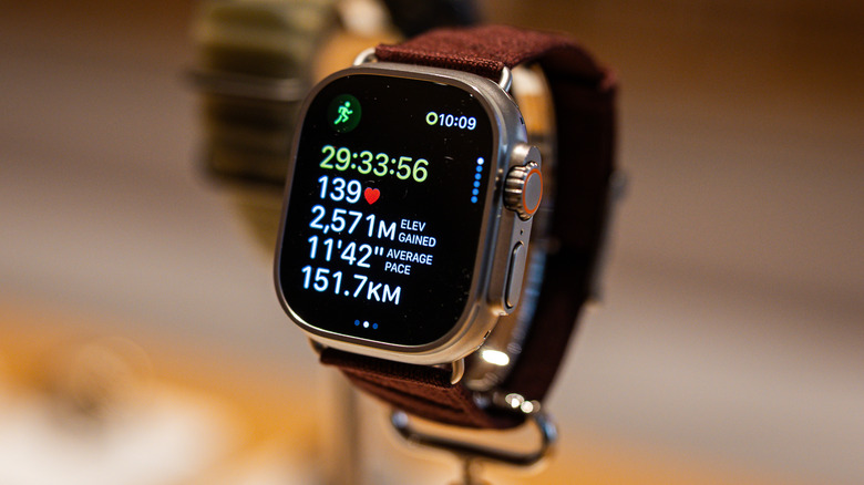 An Apple Watch Ultra 4 displays workout statistics, including heart rate, elevation gain, and distance.