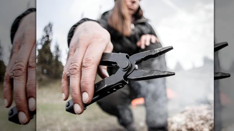 Man holding Gerber Multi-Plier 600 toward camera