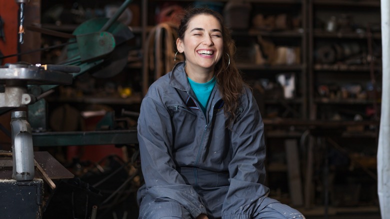 A mechanic smiling at the camera
