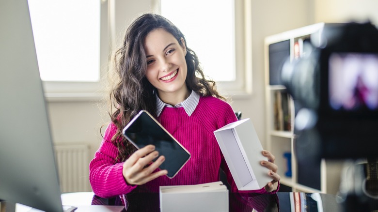 Woman opening up new phone