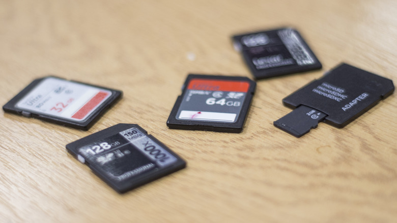 Various SD cards laid out on wood table