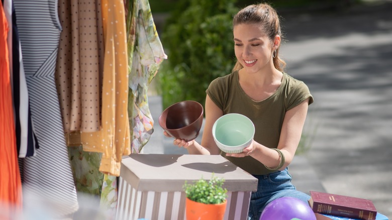 Woman compares two bowls