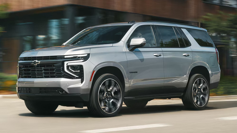 Gray 2026 Chevrolet Tahoe driving in an urban environment