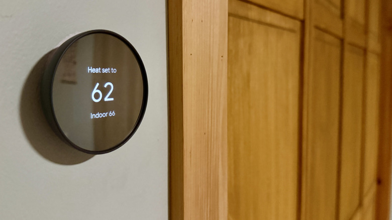 Smart thermostat on wall