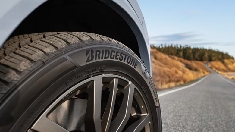 Car driving on road with Bridgestone Tires