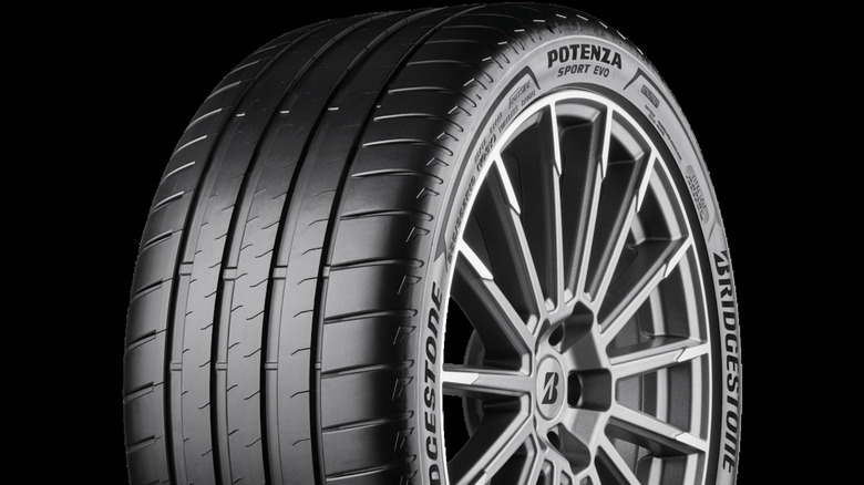 Close shot of Bridgestone Potenza Sport Evo tire sidewall and tread, mounted on wheel