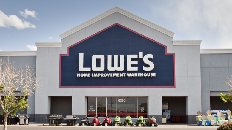 A Lowe's storefront with items out front available for sale.