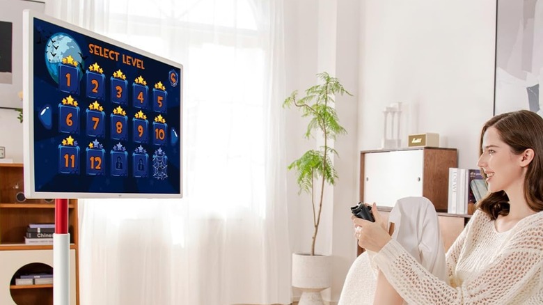 Woman playing games on KTC MegPad