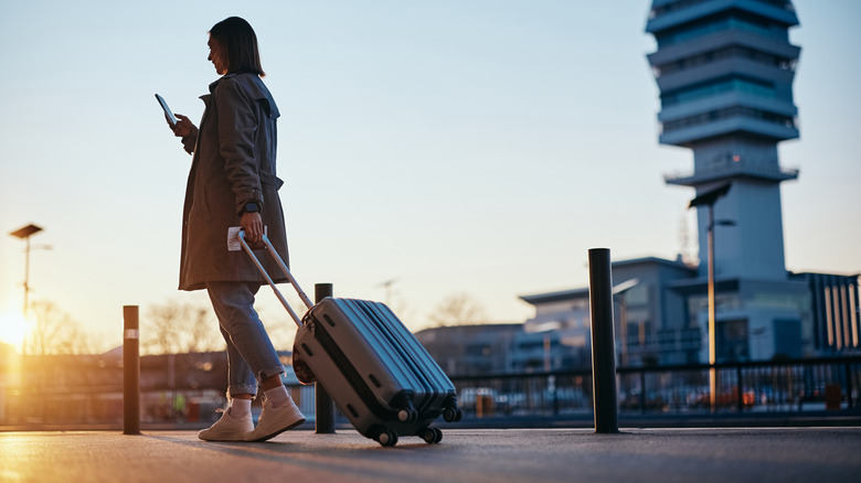 Woman walking with a suitcase