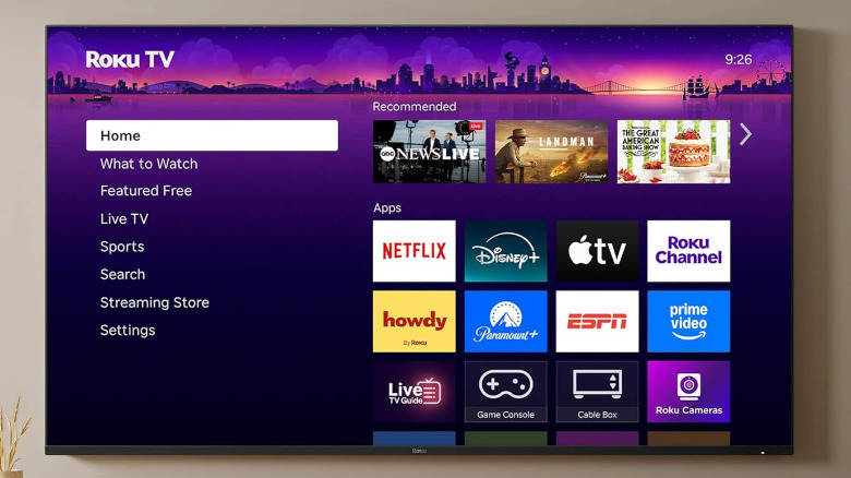 A Roku Premium TV on a wall displaying the Home menu.