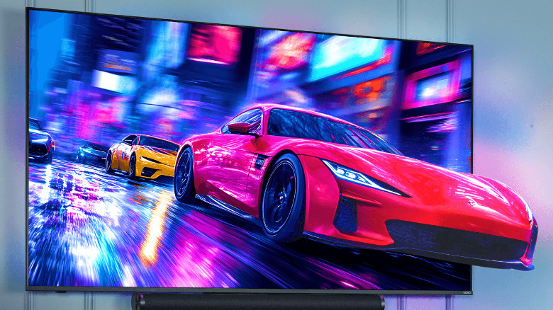 An edited photo showing a racing car exiting the screen of a vizio TV.