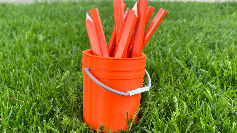A miniature 3D-printed version of the iconic Home Depot bucket filled with pencils