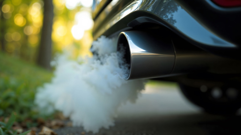 Car Exhaust Pipe Emitting thick white Smoke