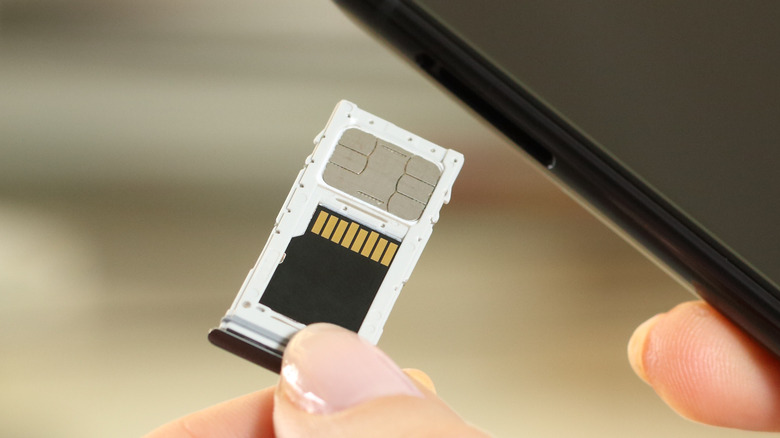 SIM card tray hand