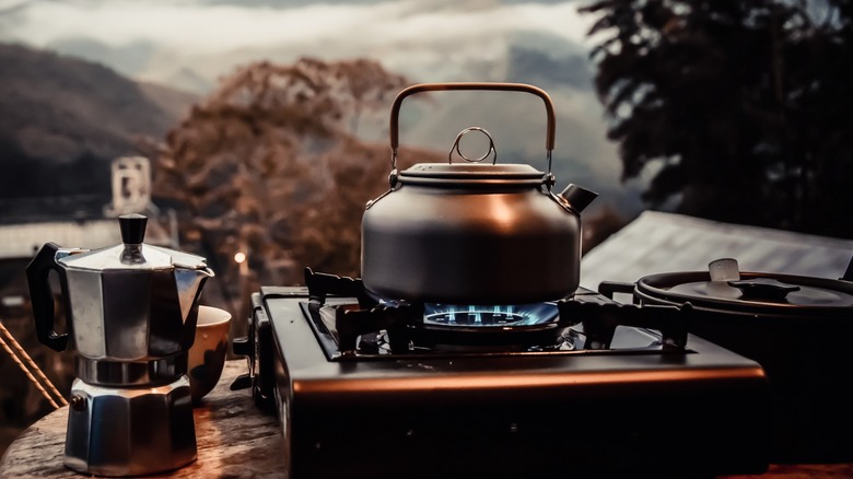Teapot on top of propane stove burner 