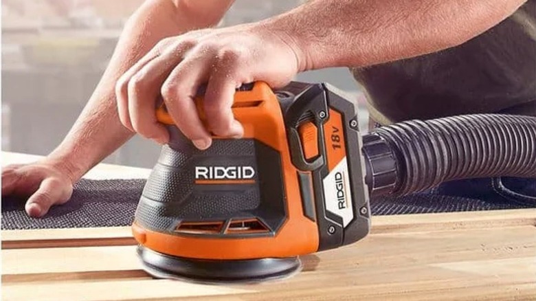 Ridgid 18V 5-inch Random Orbit Sander in use