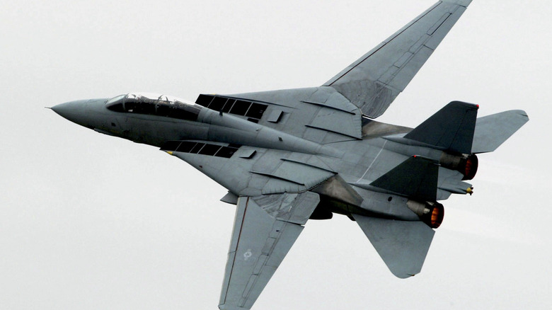 A grey F-14 taking off from Atsugi air force facility