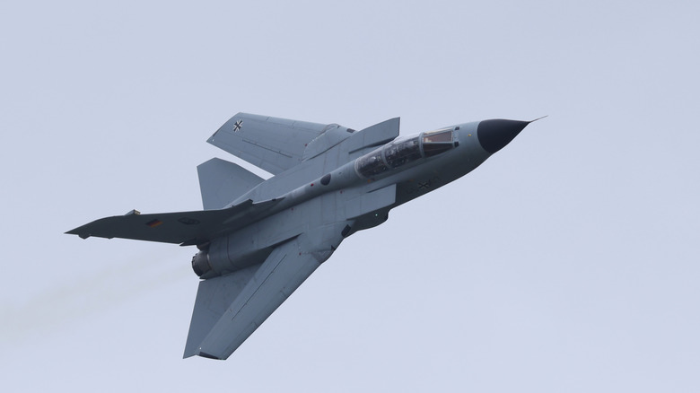 A German air force Panavia Tornado performing a high speed maneuver, top side visible