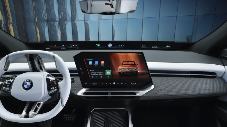 An interior view of a new BMW Neue Klasse iX3 interior showcasing massive display screens.