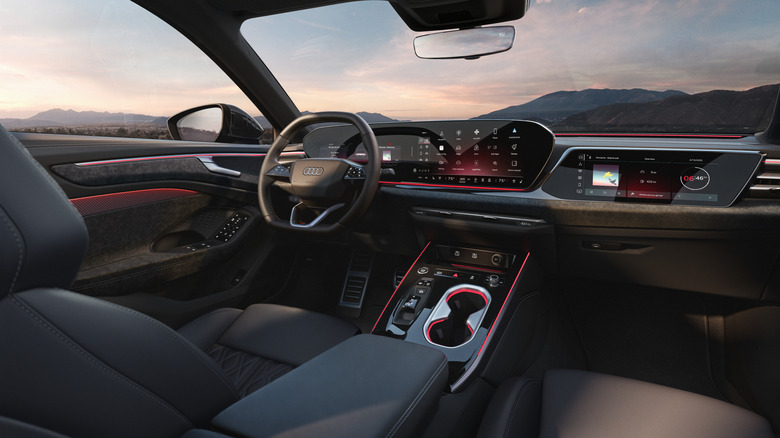 An overview of an Audi A6 interior with hills in the background.