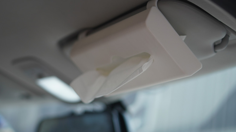 A 3D-printed tissue box attached to a car's sun visor.