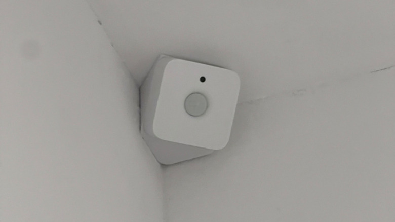 A Philips Hue motion sensor installed in an angular 3D-printed enclosure.
