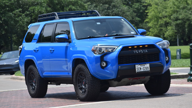A blue Toyota 4Runner being driven on the road.