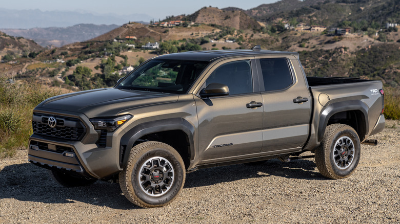 Front 3/4 view of Toyota Tacoma in mountainous setting
