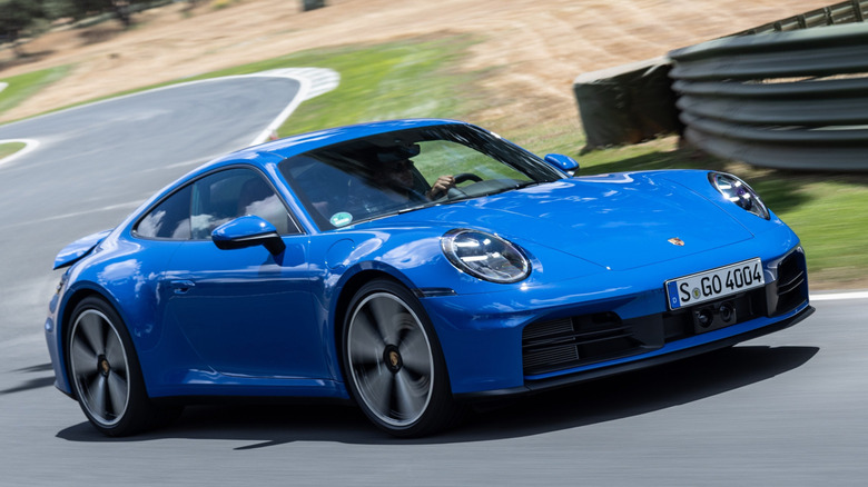 Front 3/4 view of Porsche 911 Carrera in track setting