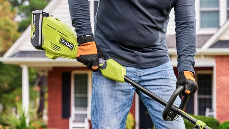 Person using 40V Ryobi Power Head