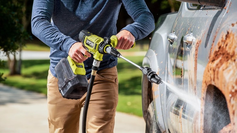 Person using 40V Ryobi Power Cleaner