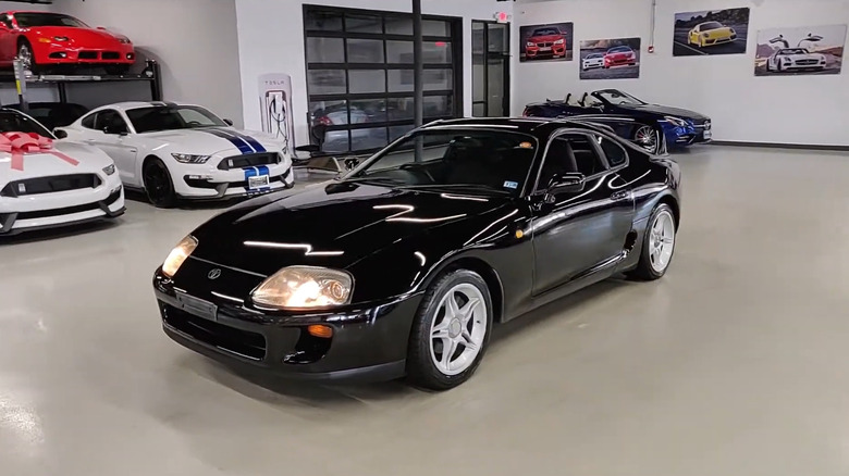 A front end shot of a black 1993 Toyota Supra A80 Turbo
