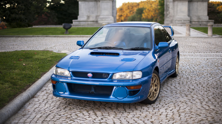 A front end shot of a blue 1998 Subaru Impreza 22B STi