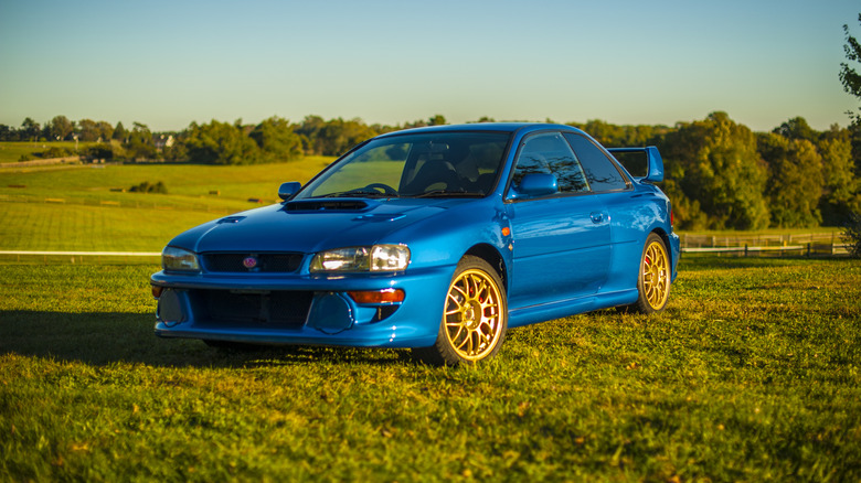 A side on shot of a blue 1998 Subaru Impreza 22B STi
