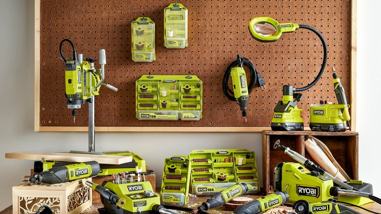 Assorted Ryobi tools and accessories on a workbench.