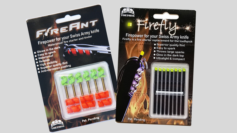 A packet of FireAnt firestarters and a packet of Firefly firestarters on a gray background. Both packets display the words "Firepower for your Swiss Army Knife"
