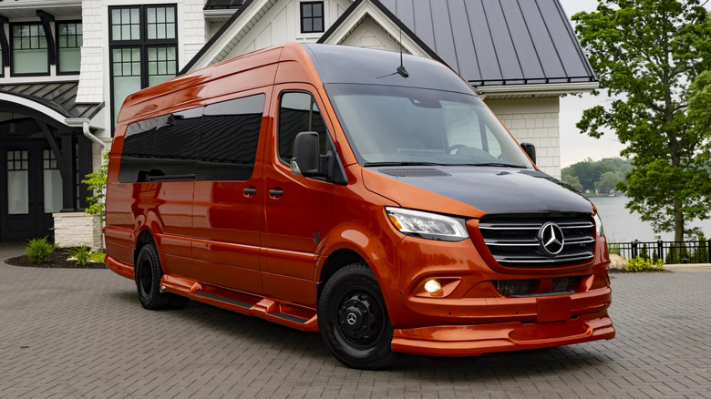 The OGV Luxury Coach Sprinter van in front of a house