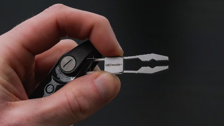 Hand holding the KeySmart Nano Pliers