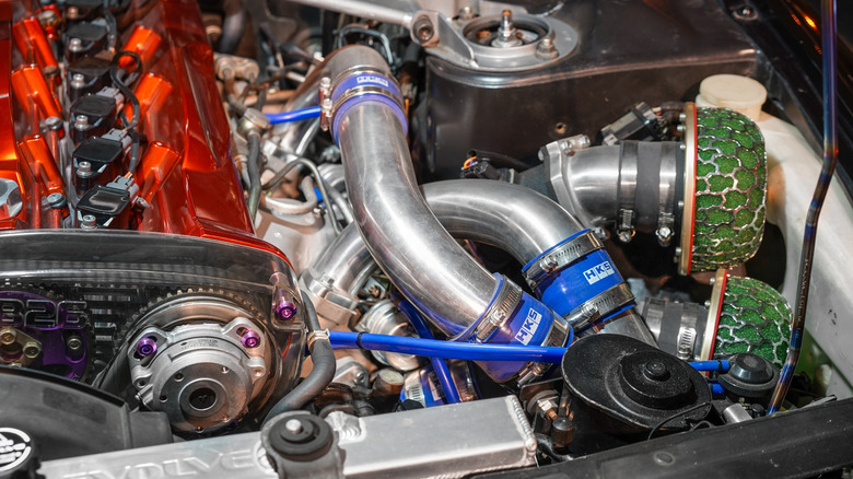 Aftermarket twin turbocharger piping on customized Nissan RB26DETT engine block
