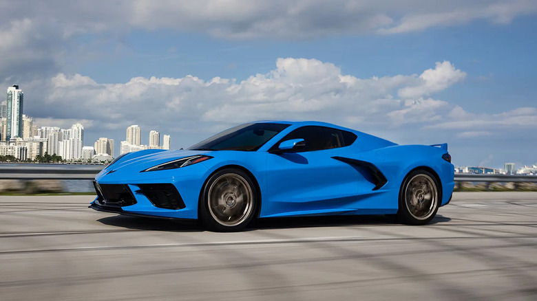 A blue 2025 Chevrolet Corvette Stingray driving