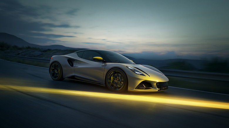 A gray 2026 Lotus Emira Tubro SE driving
