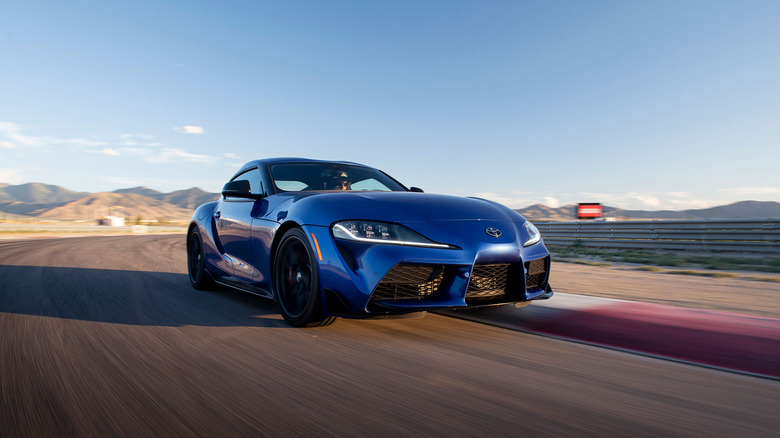A blue 2026 Toyota Supra 3.0 Premium driving on track