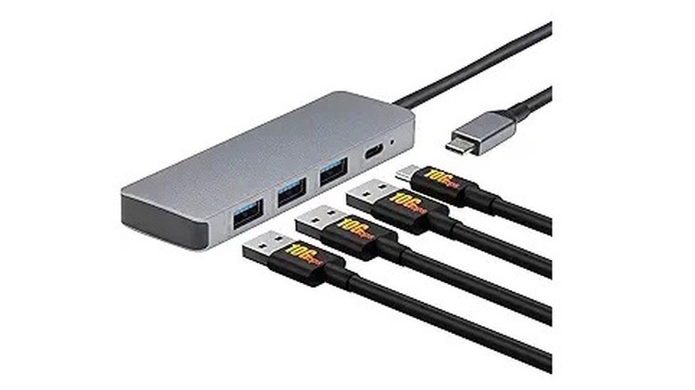 Silver USB Hub Dock with USB cables plugging into it with a white background