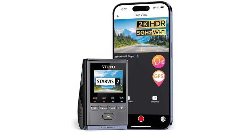 Black dash camera and phone isolated against a white background