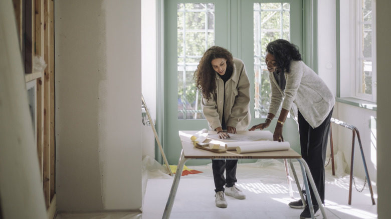 pair of home improvers working on their plans
