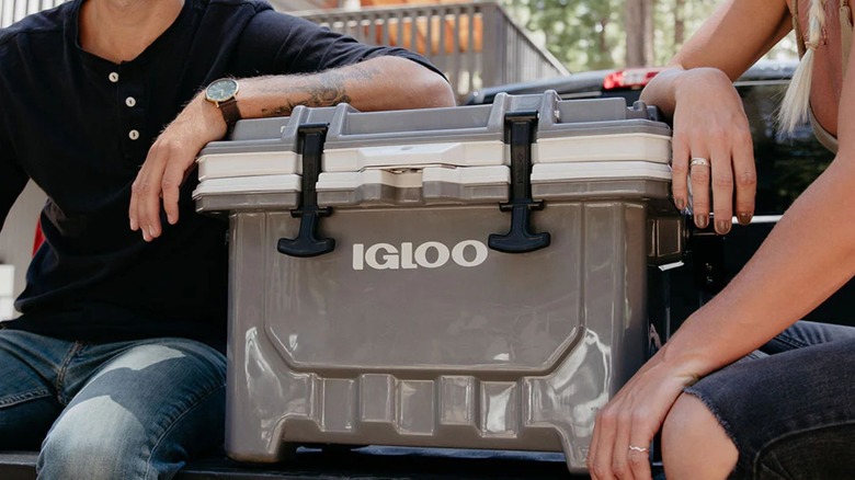 two people resting arms on igloo imx cooler