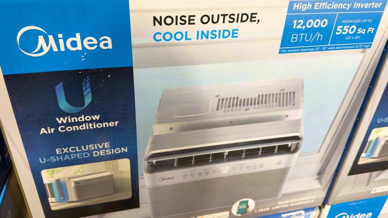 A retail store packaging box of a Midea U-shaped window air conditioner.
